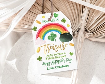 May include: A white tag with a rainbow, pot of gold, and shamrocks. The text reads "You are a treasure. Lucky to have a friend like you! Happy St. Patrick's Day! Love, Charlotte."