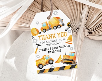 May include: A white thank you tag with a yellow and gray construction theme. It says "Thank You for showering us with love Jessica's Baby Shower 03.20.2025".