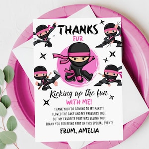 May include: Pink and black thank you card with a ninja illustration. The card says "Thanks for kicking up the fun with me!" and "From, Amelia".