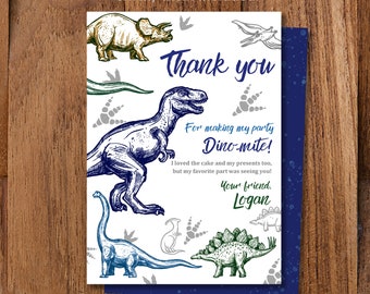 May include: A thank you card with a dinosaur theme. The card is white with blue and green dinosaur illustrations. The text on the card reads "Thank you for making my party Dino-mite! I loved the cake and my presents too, but my favorite part was seeing you! Your friend, Logan."