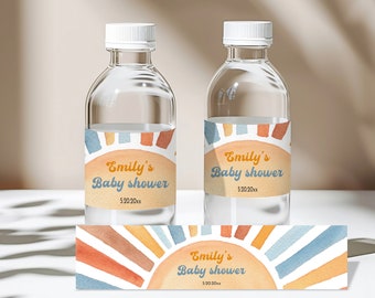 May include: Two clear water bottles with labels that say "Emily's Baby Shower" in a retro font. The labels feature a watercolor illustration of a sun with orange, yellow, and blue rays. A third label with the same design is shown below the bottles.