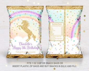 May include: A party-themed chip bag with a gold glitter top and bottom. The front features a gold glitter unicorn, rainbow, and text that reads "Charlotte's Happy 5th Birthday". The back has a nutrition facts label and a rainbow design.