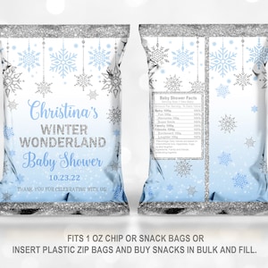 May include: Blue and silver snowflake themed baby shower favor bags with the text "Christina's Winter Wonderland Baby Shower 10.23.22 Thank you for celebrating with us!" and "Baby Shower Facts" printed on the front and back. The bags are designed to fit 1 oz chip or snack bags.
