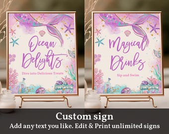 May include: Two printable mermaid-themed signs with a pink and purple watercolor background. The signs feature a mermaid tail, seashells, and starfish. The text on the signs reads "Ocean Delights Dive into Delicious Treats" and "Magical Drinks Sip and Swim".