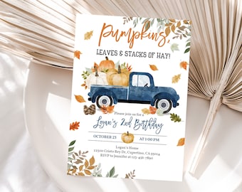May include: A blue pickup truck with a bed full of pumpkins, leaves, and hay. The truck is driving on a white background with the text "Pumpkins, Leaves & Stacks of Hay!" and "Logan's 2nd Birthday" in orange and blue lettering. The text "October 23 at 1:00 PM" is also included in the image.
