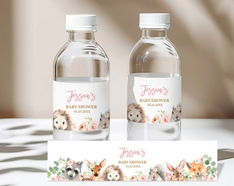 May include: Water bottle labels with a woodland theme. The labels feature a pink floral design with a hedgehog, squirrel, and deer. The text on the label reads "Jessicas's Baby Shower 01.20.20XX".