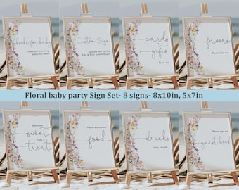 May include: Set of eight floral baby shower signs with watercolor floral borders and calligraphy text. The signs are 8x10 inches and 5x7 inches. The signs include: Books for Baby, Custom Sign, Cards & Gifts, Favors, Babies are Sweet Treat, Please Enjoy Some Food, Drinks Help Yourself, and Guest Book.