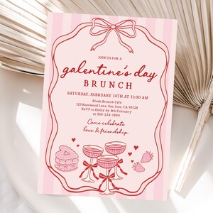 May include: Pink Galentine's Day brunch invitation with a red bow and frame. The invitation includes the text "galentine's day BRUNCH" and event details. Decorative elements include champagne glasses, cake, and strawberries.