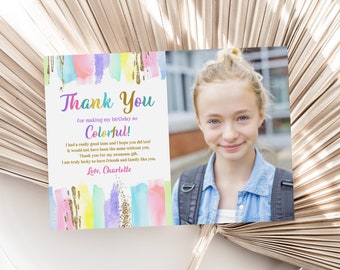 May include: Thank you card with a colorful watercolor background and gold glitter accents. The card features a photo of a young girl with blonde hair and blue eyes. The text on the card reads "Thank You for making my birthday so Colorful! I had a really good time and I hope you did too! It would not have been the same without you. Thank you for my awesome gift. I am truly lucky to have friends and family like you. Love, Charlotte."
