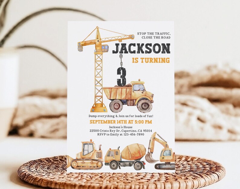May include: A watercolor-style birthday invitation featuring construction vehicles and a crane. The invitation reads "Jackson is Turning 3" with event details. The design includes a dump truck, bulldozer, cement mixer, and excavator.