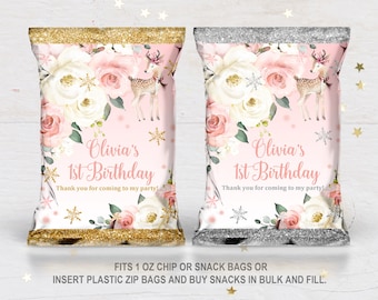 May include: Pink and white floral chip bags with a gold or silver glitter border. The bags feature a deer with antlers and the text "Olivia's 1st Birthday" with the message "Thank you for coming to my party!" printed on them.  FITS 1 OZ CHIP OR SNACK BAGS OR INSERT PLASTIC ZIP BAGS AND BUY SNACKS IN BULK AND FILL.