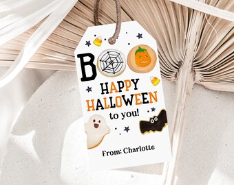 May include: White gift tag with a black and orange "Boo Happy Halloween to you!" message. The tag is decorated with star and spider web cookie designs. The tag is signed "From: Charlotte".