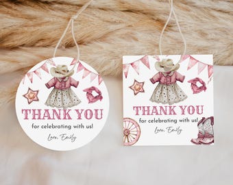 May include: Two round thank you tags with pink and white watercolor designs. The tags feature a girl wearing a pink and white cowgirl outfit with a pink hat. The text on the tags reads "Thank you for celebrating with us! Love, Emily."