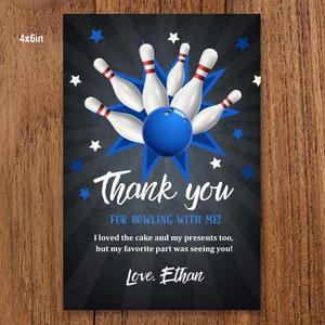 May include: A thank you card with a bowling theme. The card features a blue bowling ball and five white bowling pins with red stripes. The text on the card reads "Thank you for bowling with me! I loved the cake and my presents too, but my favorite part was seeing you! Love. Ethan."