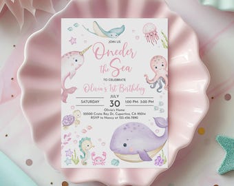 May include: A pink and blue invitation card with a watercolor illustration of a seahorse, a whale, an octopus, and a narwhal. The text on the card reads "Oneder the Sea" and "Olivia's 1st Birthday".
