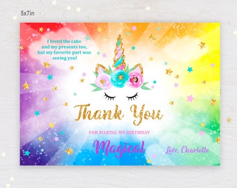 May include: A unicorn thank you card with a rainbow background and gold glitter stars. The card says "I loved the cake and my presents too, but my favorite part was seeing you!" and "Thank You for making my birthday Magical. Love, Charlotte."