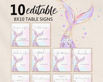 May include: Ten 8x10 inch printable table signs featuring a mermaid tail design with purple, pink, and gold accents. The signs include text such as "Diaper Raffle", "Custom Sign", "Books & Gifts", "Food", "Favors", "Drinks", "Babies are Sweet", "Late Night Diapers", "Help the Mom to Be", and "Don't Say Baby".