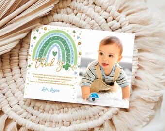 May include: A thank you card with a rainbow, shamrocks, and gold glitter. The card has a photo of a baby boy in a striped shirt and overalls. The text on the card reads "Thank you" and "I had a really good time and I hope you did too! It would not have been the same without you. Thank you for my awesome gift. I am truly lucky to have friends and family like you. Love, Logan."