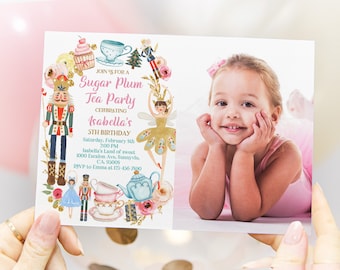 May include: A pink and blue invitation for a Sugar Plum Tea Party celebrating Isabella's 5th birthday. The invitation features a watercolor illustration of a nutcracker, a fairy, teacups, and a teapot. The invitation also includes a photo of a young girl in a pink tutu.