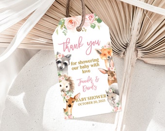 May include: Pink and gold thank you tag with a watercolor illustration of woodland animals, flowers, and greenery. The text reads "thank you for showering our baby with love Jennifer & David's Baby Shower October 20, 2025".