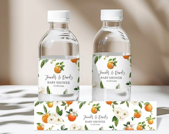 May include: Water bottle labels with a floral design featuring white flowers and orange citrus fruit. The labels have the text "Jennifer & David's Baby Shower 07.28.20XX" printed on them.