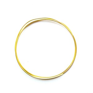 May include: A close-up of a gold-coloured wire circle, likely used for jewellery making or crafting.
