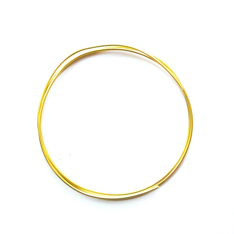 May include: A close-up of a gold-coloured wire circle, likely used for jewellery making or crafting.