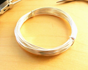 May include: A coil of silver wire, perfect for jewelry making or crafting projects.