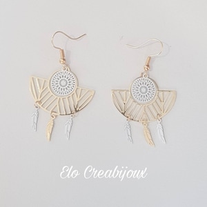 Earrings catches golden and white dream