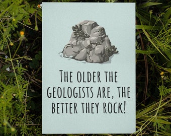 May include: A light blue card with a cartoon illustration of a rock and the text "The older the geologists are, the better they rock!"