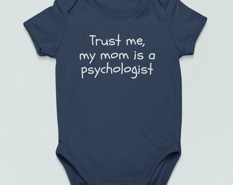 May include: A navy blue baby onesie with white text that reads "Trust me, my mom is a psychologist."
