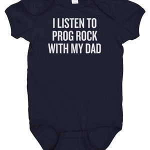 May include: A navy blue baby onesie with white text that reads "I listen to prog rock with my dad."