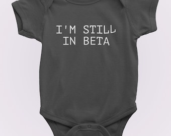 Funny Baby One-piece - Programmer Baby Shirt - IT Bodysuit - Coding Baby Apparel - Baby Gift Idea - Many Sizes And Colors - Still In Beta