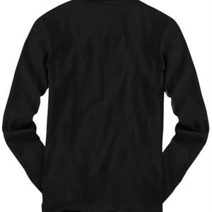 May include: Black long-sleeve t-shirt.