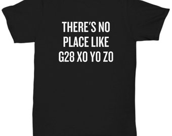 May include: A black short-sleeved t-shirt featuring white text centred on the chest that reads, THERE'S NO PLACE LIKE G28 XO YO ZO. The garment has a crew neckline and a standard fit, displaying the printed message clearly against the dark fabric.
