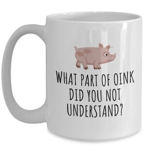 May include: White ceramic coffee mug with a pink pig illustration and the text "What part of oink did you not understand?"
