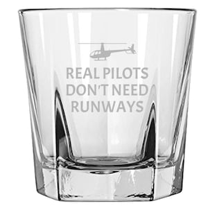 May include: A clear glass rocks glass with a white helicopter silhouette and the text "REAL PILOTS DON'T NEED RUNWAYS" etched on the side.