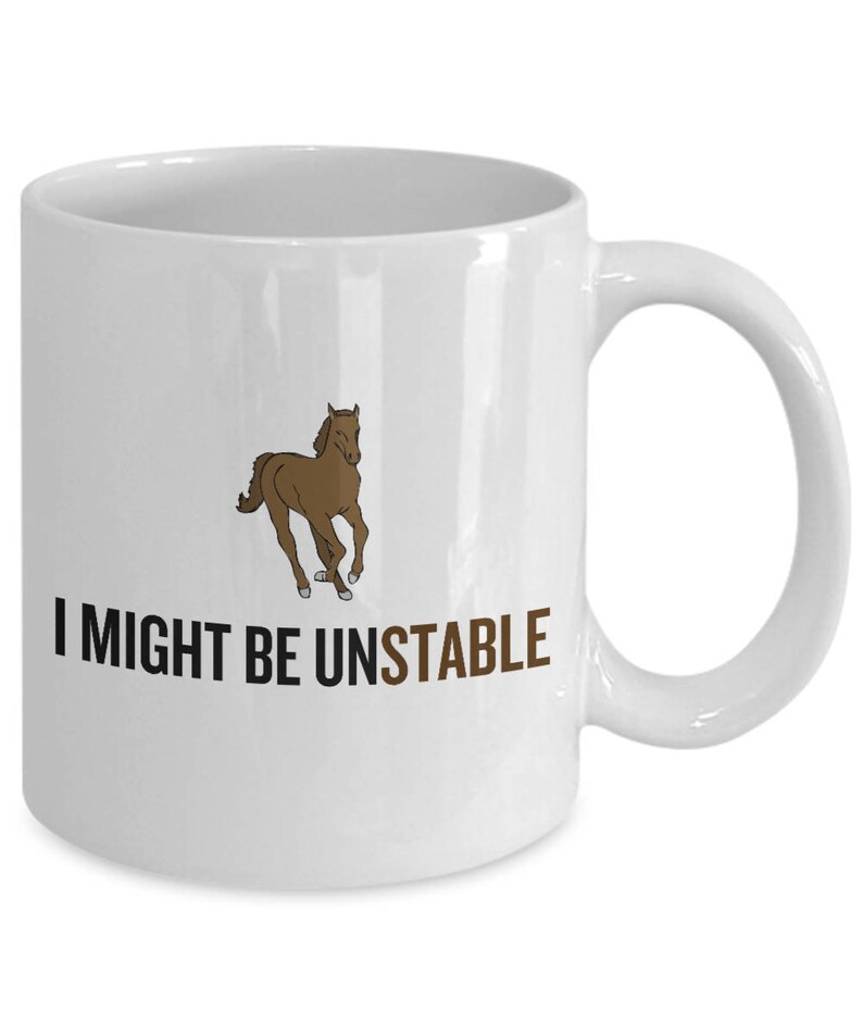 May include: White ceramic mug with a brown cartoon horse running and the text "I might be unstable" printed in black.