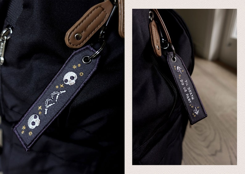 May include: A black backpack with two zippered pouches and a black and white embroidered keychain that says "Til Death Do Us Part" with a skull and crossbones design.