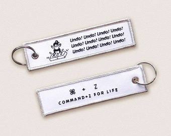 Undo Flight Tag Keychain - Angry Girl - Command Z