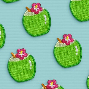 May include: A pattern of green embroidered coconut drink patches with pink flowers and a straw on a light blue background.
