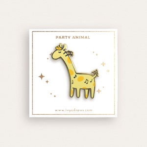 May include: A gold-colored enamel pin featuring a cartoon giraffe with musical notes on its body. The pin says "Party Animal" and "www.ivycdraws.com".
