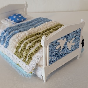 Miniature dollhouse bed and bedding. 1/12 scale
