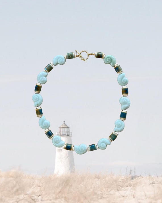 Drift | Seafoam Beaded Necklace with Ceramic Snail Shells | Coastal Statement Jewelry | REEL BLUES | Waq & Wire