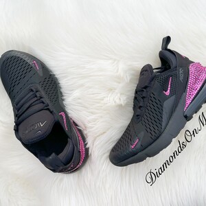 May include: Black Nike Air Max 270 sneakers with pink rhinestones on the swoosh and heel. The text "Diamonds On My Feet" is visible on the right shoe.