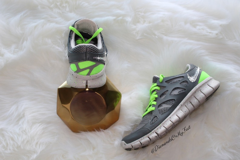 neon green and gray nike shoes