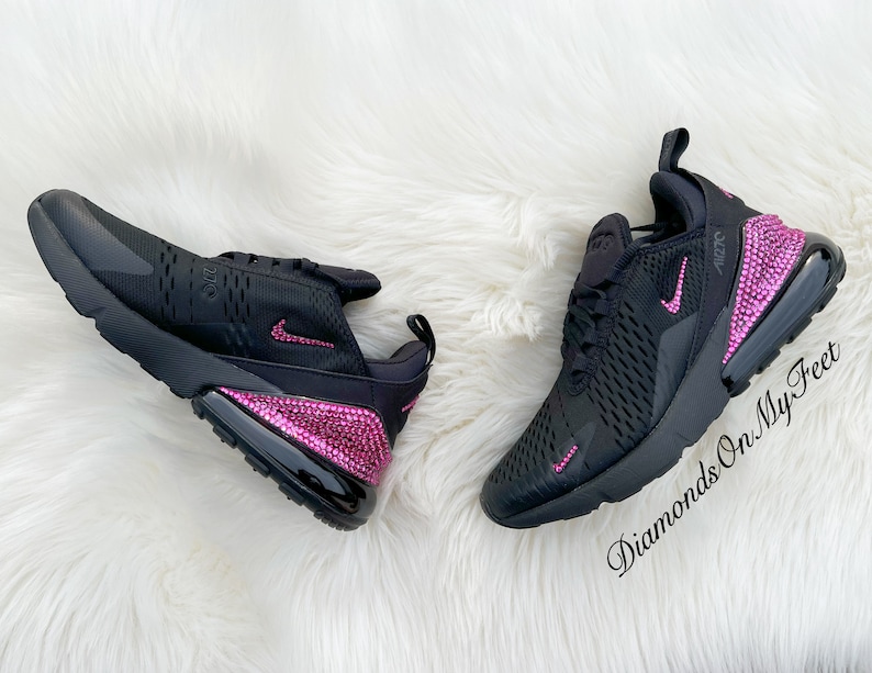 May include: Black Nike Air Max 270 sneakers with pink rhinestones on the heel and swoosh. The text "Diamonds On My Feet" is on the bottom right corner of the image.