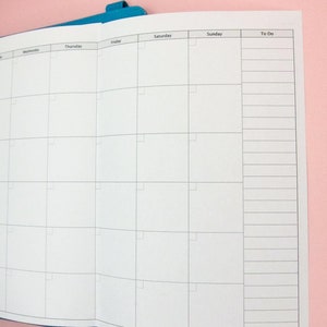 May include: A white weekly planner with a blue binder. The planner has columns for Wednesday, Thursday, Friday, Saturday, Sunday, and a To Do list.