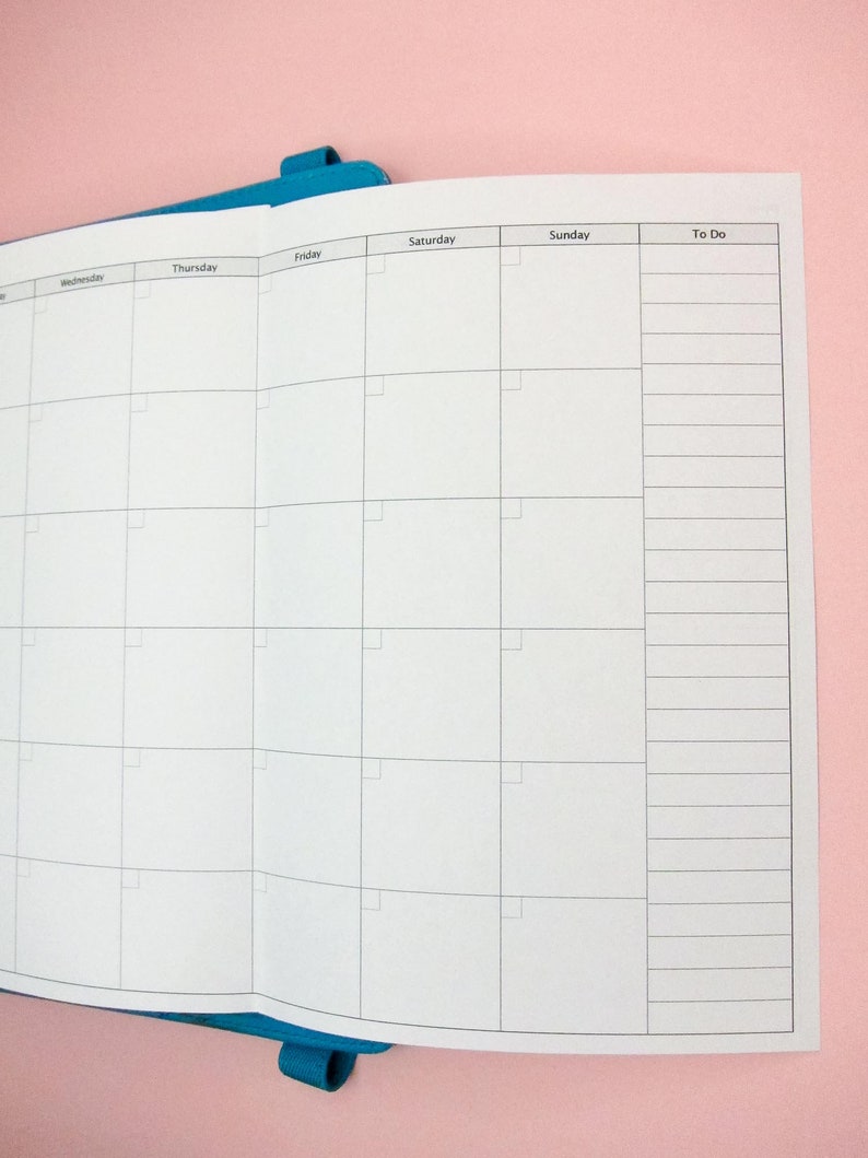 May include: A white weekly planner with a blue binder. The planner has columns for Wednesday, Thursday, Friday, Saturday, Sunday, and a To Do list.