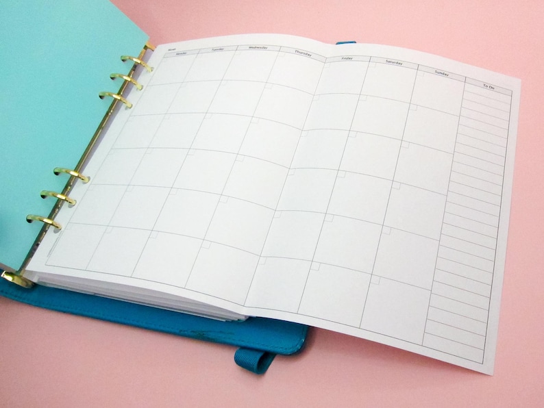 May include: A white weekly planner with a blue binder. The planner has a column for each day of the week, with a "To Do" column on the right.